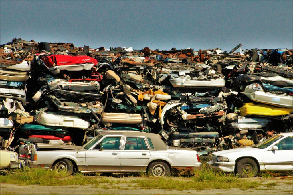 Dumped Cars on the Grass Field